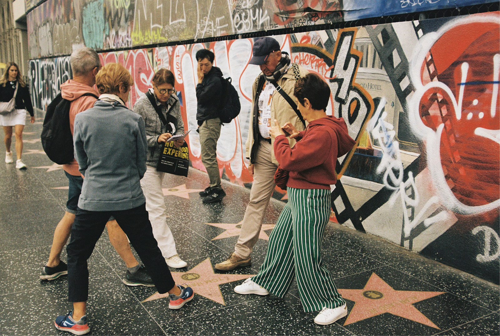 People walking along the Hollywood Walk of Fame in Los Angeles