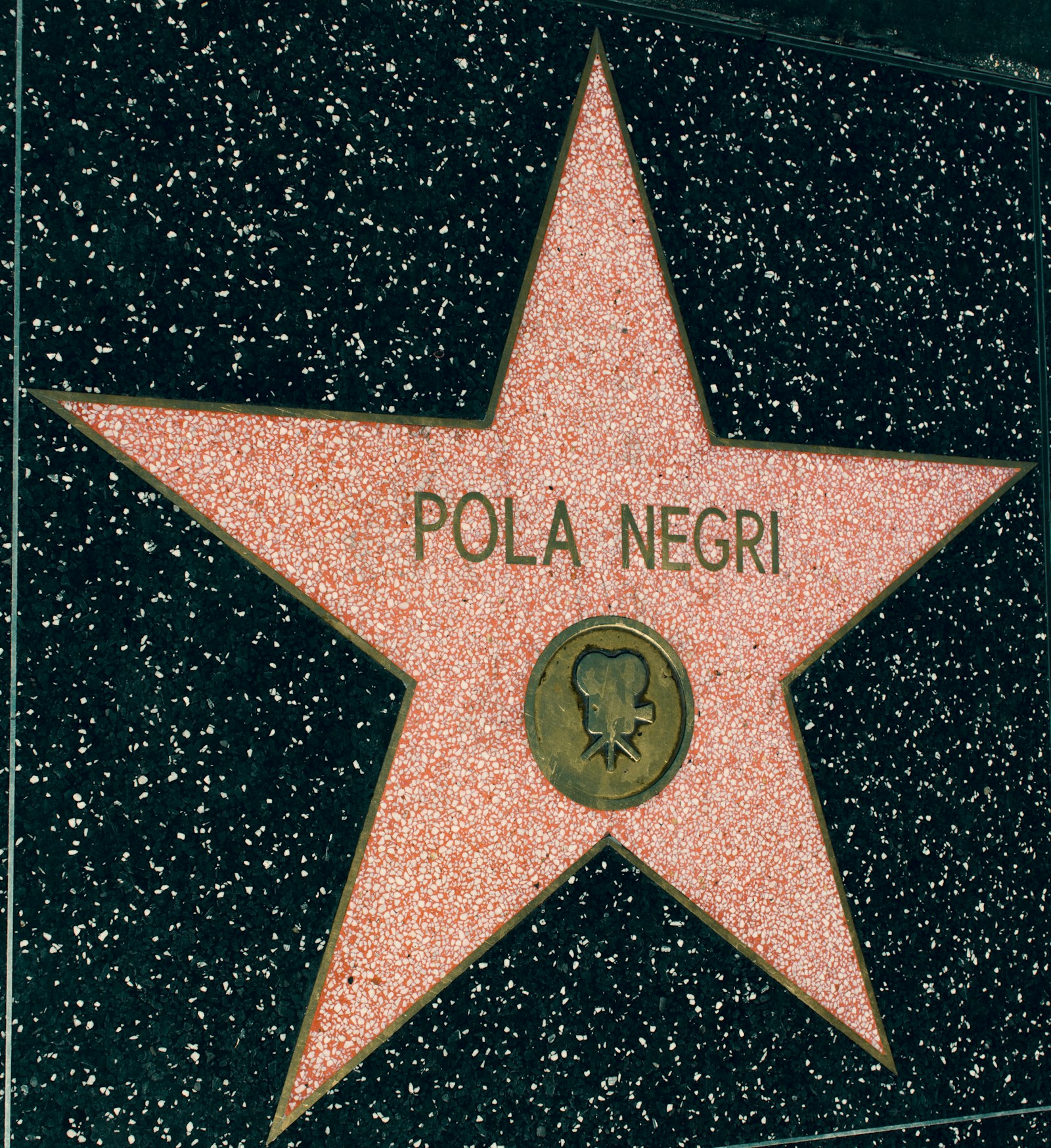 Close-up of a terrazzo star on the Hollywood Walk of Fame